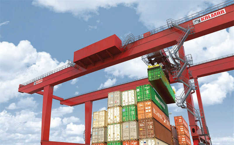 Containers handled by a rail mounted gantry crane from Kalmar
