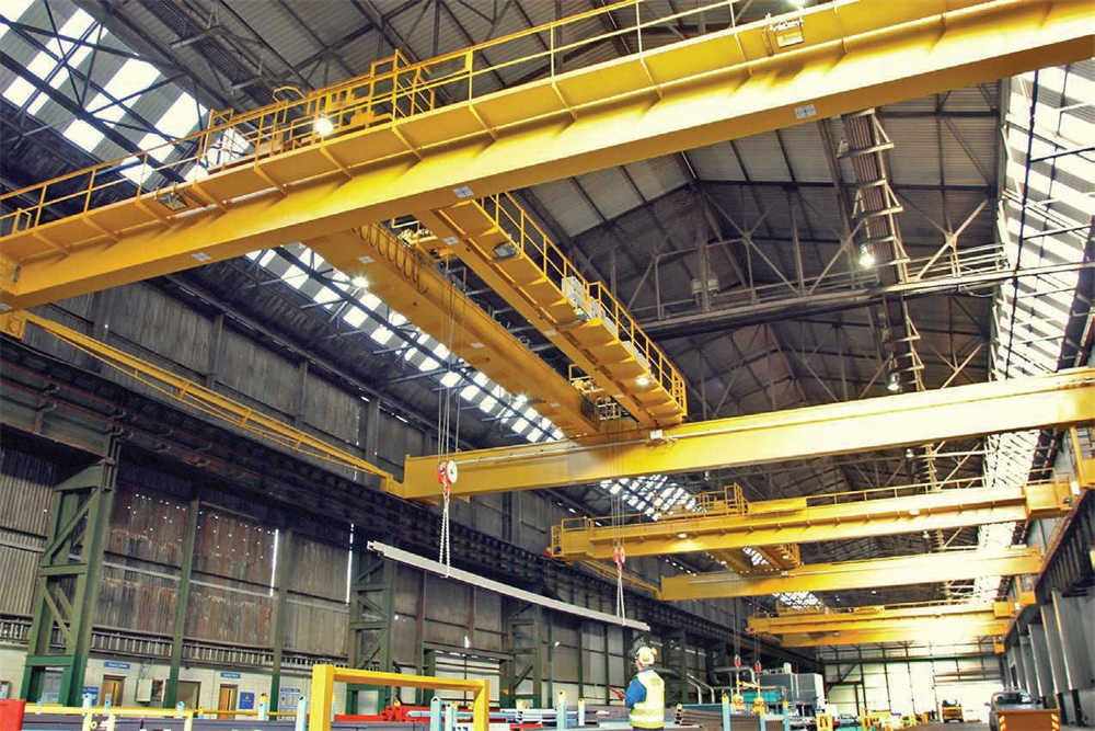 The steel distribution center uses four bridge cranes