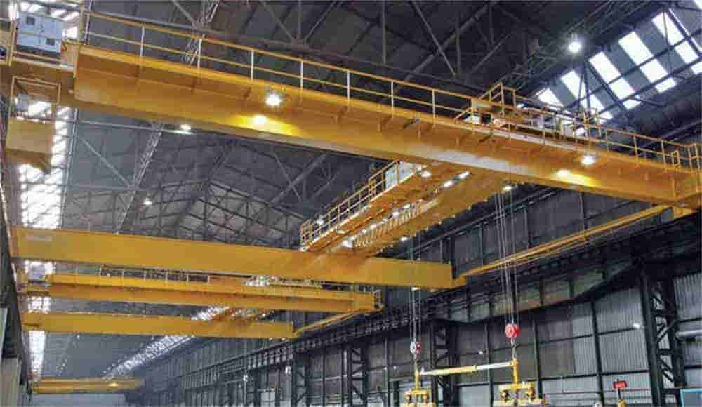 The steel distribution center uses four bridge cranes